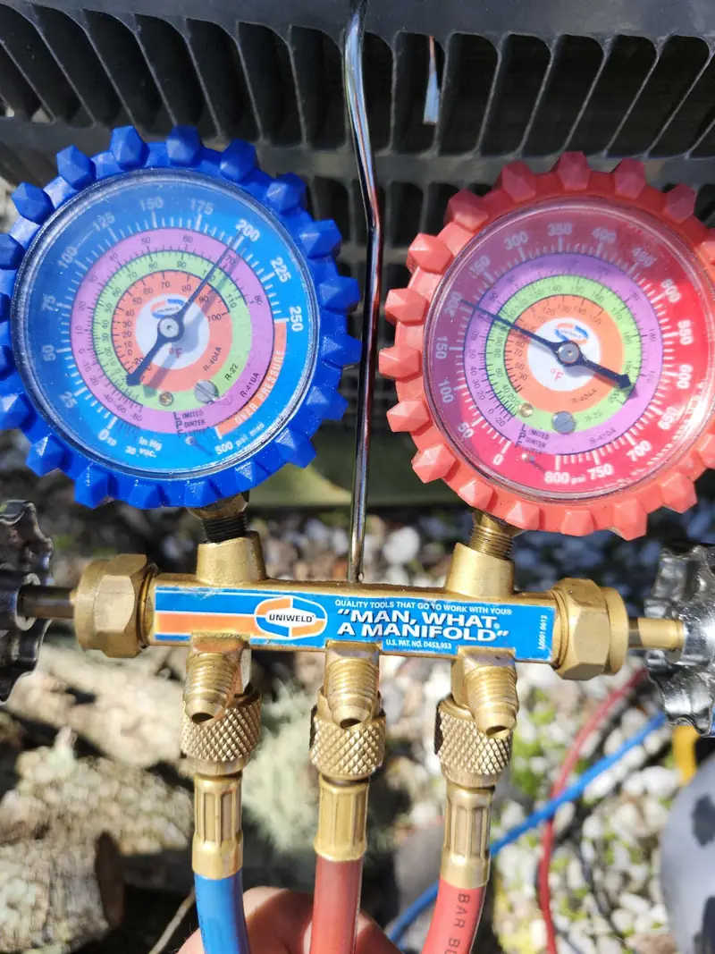 Manifold gauge set in use during a service call
