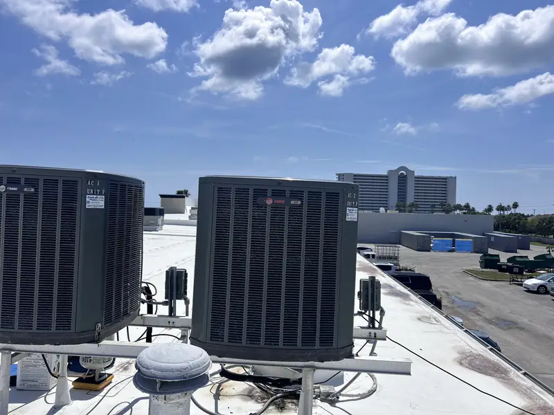 Rooftop HVAC units on a coastal commercial building