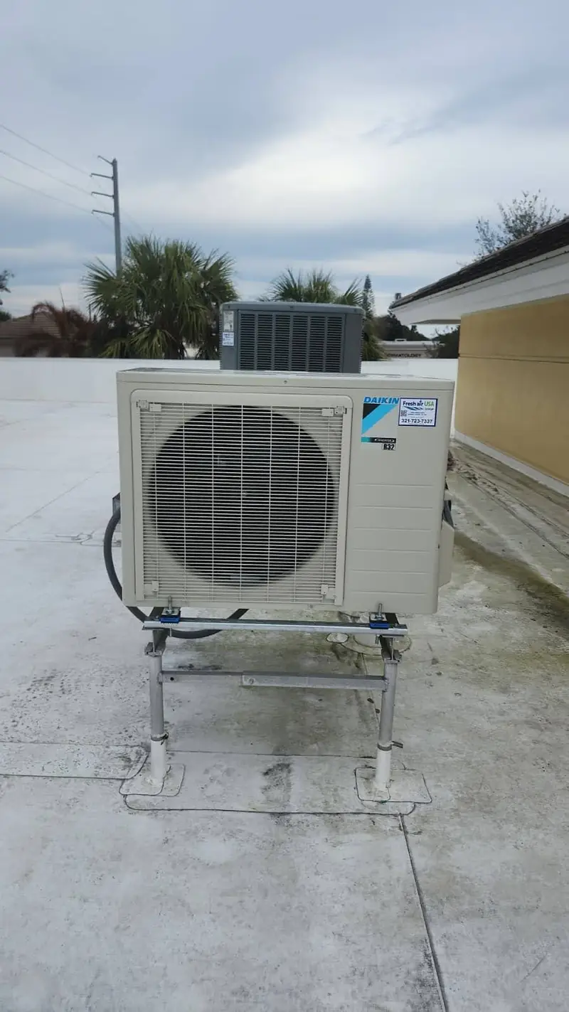 Mini-split condenser on a rooftop deck