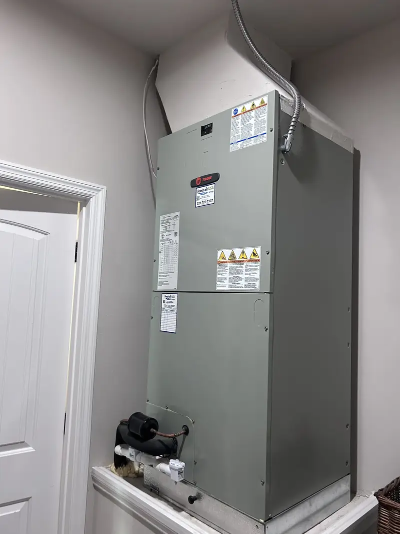Indoor air handler installed in a utility closet
