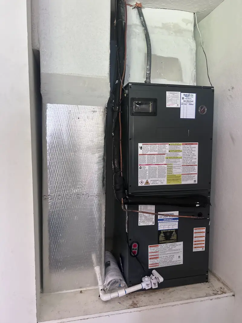 Air handler unit inside a louvered closet