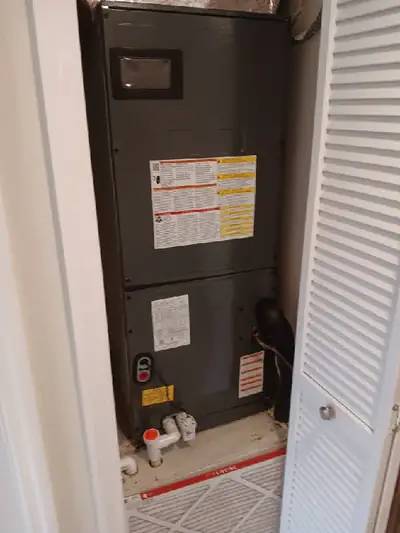 Air handler behind louvered closet doors