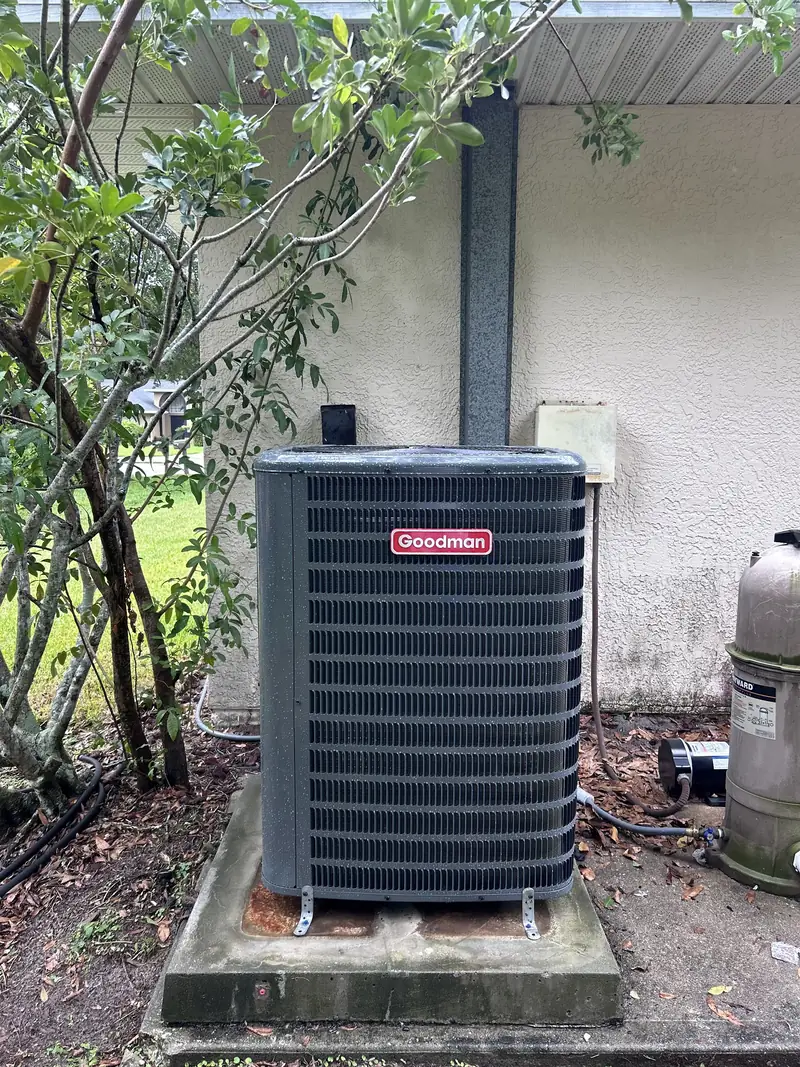 Goodman condenser installed on a raised pad