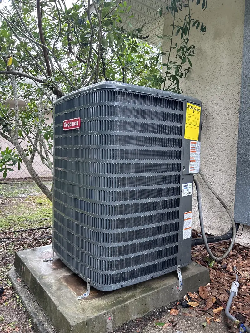 Residential condenser installed on a concrete pad